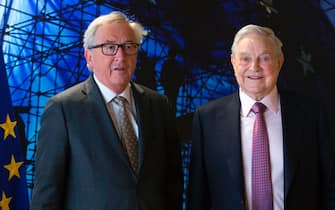 EU commission President Jean-Claude Juncker (L) welcomes George Soros, Founder and Chairman of the Open Society Foundations prior to a meeting in Brussels, on April 27, 2017. 
Meeting will mainly focus on situation in Hungary, including legislative measures that could force the closure of the Central European University in Budapest. / AFP PHOTO / POOL / OLIVIER HOSLET        (Photo credit should read OLIVIER HOSLET/AFP via Getty Images)