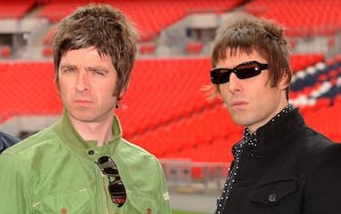 LONDON, ENGLAND - OCTOBER 16:  Noel Gallagher (left) and Liam Gallagher of Oasis pose at Wembley Stadium on October 16, 2008 in London, England. (Photo by Samir Hussein/Getty Images)