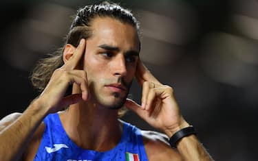 epa10814415 Gianmarco Tamberi of Italy reacts during the High Jump Men final competition of the World Athletics Championships in Budapest, Hungary, 22 August 2023.  EPA/Adam Warzawa  POLAND OUT
