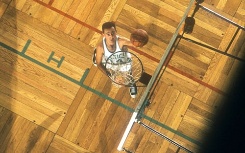 BOSTON, MA - DECEMBER 12: Bob Cousy #14 of the Boston Celtics goes for the lay-up as Dick Ricketts #15 of the Rochester Royals is late to go for the block during an NBA game on December 12, 1956 at the Boston Garden in Boston, Massachusetts.  (Photo by Hy Peskin/Getty Images) (Set Number: X4288)