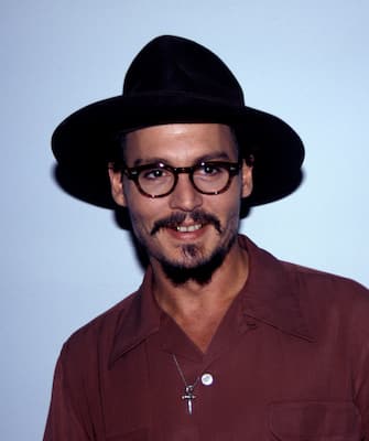 JOHNNY DEPPJanuary 2006Ref: AWheadshot portrait glasses black hat goatee mustache gold teethwww.capitalpictures.comsales@capitalpictures.comÂ© Capital Pictures