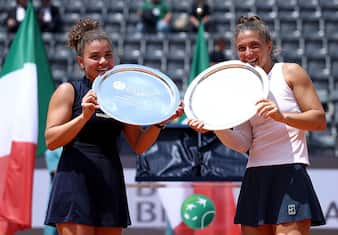 ROME, ITALY - MAY 18: Jasmine Paolini of Italy and Sara Errani of Italy pose for a photo with their trophies after their victory against Veronika Kudermetova and Elise Mertens of Belgium during the Women's Doubles Final match on Day Fourteen of the Internazionali BNL D'Italia 2025 at Foro Italico on May 18, 2025 in Rome, Italy.  (Photo by Dan Istitene/Getty Images)