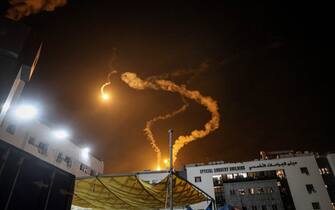 Israeli flares light up the sky above the Al-Shifa hospital in Gaza City, Gaza, on Monday, Nov. 6, 2023. About 2,260 people are reported missing in the besieged territory, in addition to more than 10,000 people who have been killed since the Israel-Hamas war began, the UN said. Photographer: Ahmad Salem/Bloomberg