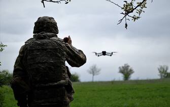 A Ukrainian serviceman of a reconnaissance team flyes a drone at a front line near the town of Bakhmut, Donetsk region on May 8, 2023, amid the Russian invasion of Ukraine. (Photo by Sergey SHESTAK / AFP) (Photo by SERGEY SHESTAK/AFP via Getty Images)