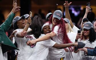 CLEVELAND, OHIO - APRIL 07: Raven Johnson #25 and Kamilla Cardoso #10 of the South Carolina Gamecocks celebrate after beating the Iowa Hawkeyes in the 2024 NCAA Women's Basketball Tournament National Championship at Rocket Mortgage FieldHouse on April 07, 2024 in Cleveland, Ohio. South Carolina beat Iowa 87-75. (Photo by Steph Chambers/Getty Images)