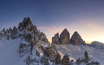 Frankfurter Wurstel (Salsiccia) rock, Monte Paterno and Tre Cime di Lavaredo at sunset, Sesto Dolomites, South Tyrol, Italy