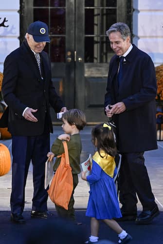 WASHINGTON DC, UNITED STATES - OCTOBER 30: United States President Joe Biden (L) arrives to greet trick-or-treaters on the South Lawn of the White House for Halloween at the White House in Washington DC, United States on October 30, 2023. US Secretary of State Antony Blinken (R) also attended the event. (Photo by Celal Gunes/Anadolu via Getty Images)