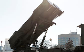 U.S. and Japanese officials, including U.S. Vice President Mike Pence and Japan's defense minister Itsunori Onodera, inspect a Japan self-defense force Patriot Advanced Capability-3 (PAC-3) missile interceptor, manufactured by Lockheed Martin Corp., at the Ministry of Defense in Tokyo, Japan, on Wednesday, Feb. 7, 2018. Pence is in Japan ahead of his visit to South Korea, where he'll try to counter North Korea's efforts to use its athletes' appearance at the games as a propaganda tool. Photographer: Kiyoshi Ota/Bloomberg