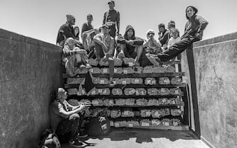De Coto family poses for a portrait aboard a freight train known as “The Beast” on their way to Ciudad Juarez before the end of Title 42 in Samalayuca, Mexico, May 8, 2023.

 Title 42 expulsions were removals of people by the United States government who have recently been in a country where a contagious disease was present. In reality, it was a measure used to expressly deny asylum applications and deport the applicants back to Mexico.