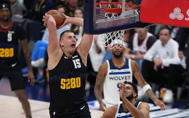 DENVER, CO - MAY 14: Nikola Jokic #15 of the Denver Nuggets dunks the ball during the game against the Minnesota Timberwolves during Round 2 Game 5 of the 2024 NBA Playoffs on May 14, 2024 at the Ball Arena in Denver, Colorado. NOTE TO USER: User expressly acknowledges and agrees that, by downloading and/or using this Photograph, user is consenting to the terms and conditions of the Getty Images License Agreement. Mandatory Copyright Notice: Copyright 2024 NBAE (Photo by Bart Young/NBAE via Getty Images)