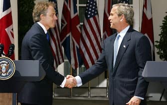 epa05410201 (FILE) A file photo dated 16 April 2004 showing then US President George W. Bush (R) shaking hands with then British Prime Minister Tony Blair after the two leaders answered questions from the news media during a joint press conference in the Rose Garden of the White House, Washington, USA. The report on whether it was right and neccessary to invade Iraq by Sir John Chilcot concluded 06 July 2016 the invasion and subsequent war against Iraq was 'not the last resort'. Chilcot also said US and British policy on Iraq based on 'flawed intelligence and assessments'.  EPA/SHAWN THEW