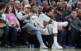 MILWAUKEE, WISCONSIN - NOVEMBER 08: Giannis Antetokounmpo #34 of the Milwaukee Bucks sits next to fans after being ejected during the second half of a game against the Detroit Pistons at Fiserv Forum on November 08, 2023 in Milwaukee, Wisconsin. NOTE TO USER: User expressly acknowledges and agrees that, by downloading and or using this photograph, User is consenting to the terms and conditions of the Getty Images License Agreement. (Photo by Stacy Revere/Getty Images)