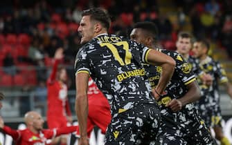 Udinese's forward Lorenzo Lucca jubilates after scoring goal during the Italian Serie A soccer match between AC Monza and Udinese at U-Power Stadium in Monza, Italy, 29 October 2023. ANSA / ROBERTO BREGANI