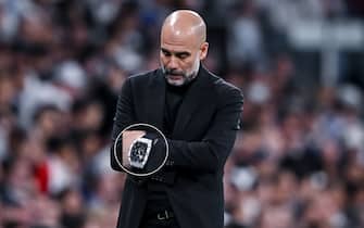 MADRID, SPAIN - APRIL 9: head coach Josep Guardiola of Manchester City looks dejected during the UEFA Champions League quarter-final first leg match between Real Madrid CF and Manchester City at Estadio Santiago Bernabeu on April 9, 2024 in Madrid, Spain. (Photo by Harry Langer/DeFodi Images via Getty Images)