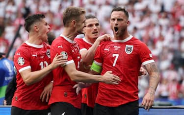 BERLIN, GERMANY - JUNE 21: Marko Arnautovic of Austria celebrates scoring his team's third goal from a penalty kick with teammates during the UEFA EURO 2024 group stage match between Poland and Austria at Olympiastadion on June 21, 2024 in Berlin, Germany. (Photo by Joosep Martinson - UEFA/UEFA via Getty Images)