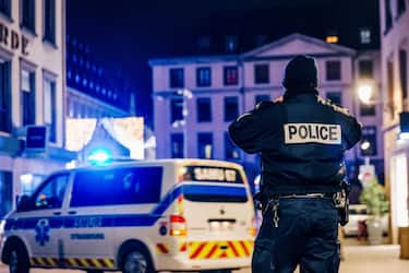 Police and emergency services intervene on Place Gutenberg after a shooting on December 11, 2018 in Strasbourg, eastern France. The suspect who killed at least two people and injured 11 at Strasbourg's Christmas market was due to be arrested by police earlier in the day over a separate attempted murder, a source close to the investigation said. (Photo by Abdesslam MIRDASS / AFP) (Photo by ABDESSLAM MIRDASS/AFP via Getty Images)