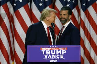 WEST PALM BEACH, FLORIDA - NOVEMBER 06: Republican presidential nominee, former U.S. President Donald Trump arrives to speak with Donald Trump Jr. during an election night event at the Palm Beach Convention Center on November 06, 2024 in West Palm Beach, Florida. Americans cast their ballots today in the presidential race between Republican nominee former President Donald Trump and Vice President Kamala Harris, as well as multiple state elections that will determine the balance of power in Congress.   Joe Raedle/Getty Images/AFP (Photo by JOE RAEDLE / GETTY IMAGES NORTH AMERICA / Getty Images via AFP)