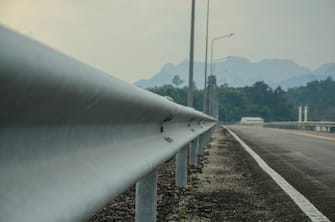 guardrail, is a system designed to keep people or vehicles from straying into dangerous or off-limits areas.