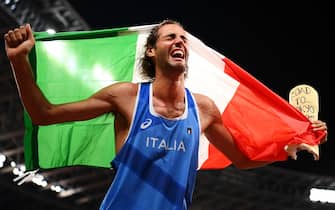 TOKYO, JAPAN - AUGUST 01: Gianmarco Tamberi of Team Italy reacts after winning the gold medal in the men's High Jump on day nine of the Tokyo 2020 Olympic Games at Olympic Stadium on August 01, 2021 in Tokyo, Japan. (Photo by Matthias Hangst/Getty Images)