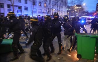 epa10534221 French riot police clash with protesters during a demonstration against the government pension reform at Vauban square in Paris, France, 20 March 2023. Protests continued in France after the French prime minister announced on 16 March 2023 the use of Article 49 paragraph 3 (49.3) of the French Constitution to have the text on the controversial pension reform law be definitively adopted without a vote in the National Assembly (lower house of parliament). The bill would raise the retirement age in France from 62 to 64 by 2030.  EPA/CHRISTOPHE PETIT TESSON