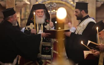 Greek Orthodox Patriarch of Jerusalem Theophilos III leads prayers during a procession dedicated to peace in Israel and Gaza, at the Holy Sepulchre Church in the Old City of Jerusalem, on October 22, 2023. (Photo by AHMAD GHARABLI / AFP) (Photo by AHMAD GHARABLI/AFP via Getty Images)