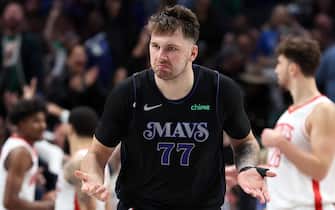 DALLAS, TEXAS - NOVEMBER 28: Luka Doncic #77 of the Dallas Mavericks reacts after making a basket against the Houston Rockets in the second half during an NBA In-Season Tournament game at American Airlines Center on November 28, 2023 in Dallas, Texas. NOTE TO USER: User expressly acknowledges and agrees that, by downloading and or using this photograph, User is consenting to the terms and conditions of the Getty Images License Agreement. (Photo by Tim Heitman/Getty Images)