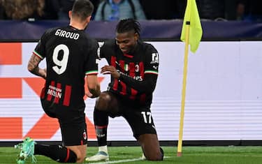 AC Milan's French forward Olivier Giroud (L) celebrates with AC Milan's Portuguese forward Rafael Leao after opening the scoring during the UEFA Champions League quarter-finals second leg football match between SSC Napoli and AC Milan on April 18, 2023 at the Diego-Maradona stadium in Naples. (Photo by Alberto PIZZOLI / AFP) (Photo by ALBERTO PIZZOLI/AFP via Getty Images)
