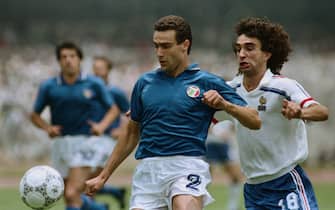 (Original Caption) Mexico City: France's Dominique Rocheteau (18) challenges Italy's Giuseppe Bergomi (2) during the first half of the second round World Cup match at Olympic stadium Mexico City June 17.