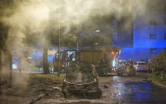 LILLE, FRANCE - JULY 02: Firefighters conduct work at the scene where a vehicle burned by demonstrators to protest the death of 17-year-old Nahel, who was shot in the chest by police in Nanterre on June 27, in Lille, France on July 02, 2023. (Photo by Hadi Mehraeen/Anadolu Agency via Getty Images)