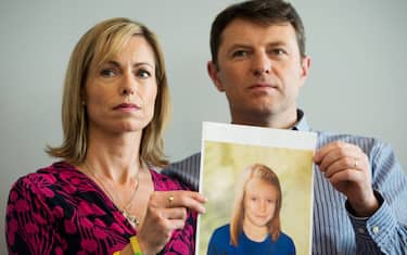 Parents of missing girl Madeleine McCann, Kate (L) and Gerry McCann (R) pose with an artist's impression of how their daughter might look now at the age of nine ahead of a press conference in central London on May 2, 2012 five years after Madeleine's disappearance while on a family holiday in Portugal.  Aged three at the time, the artist's impression depicts how Madeleine may now look, based on family photos of her, along with childhood images of her parents.  AFP PHOTO / LEON NEAL        (Photo credit should read LEON NEAL/AFP/GettyImages)