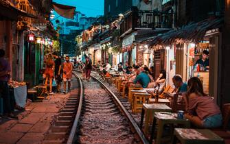 HANOI, VIETNAM - OCT 02, 2019 : Restaurants near train street in Hanoi at night.