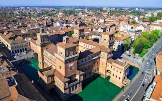 Ferrara - beautiful medieval town in Emilia Romagna Italy. aerial drone view of castle Estense in historic center