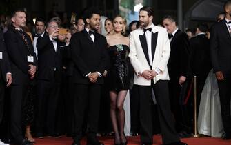 CANNES, FRANCE - MAY 22: (L-R) Abel “The Weeknd” Tesfaye, Lily-Rose Depp and Sam Levinson attend the "The Idol" red carpet during the 76th annual Cannes film festival at Palais des Festivals on May 22, 2023 in Cannes, France. (Photo by Pascal Le Segretain/Getty Images)