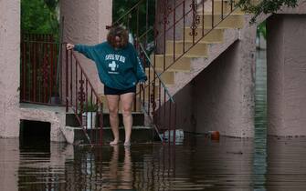 TARPON SPRINGS, FLORIDA - AUGUST 30: Tina Kruse looks out at the flood waters from Hurricane Idalia surrounding her apartment complex on August 30, 2023 in Tarpon Springs, Florida. Hurricane Idalia is hitting the Big Bend area of Florida.  (Photo by Joe Raedle/Getty Images)