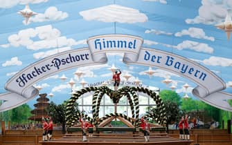 14 September 2023, Bavaria, M?nchen: A banner with the inscription Ã Heaven of BavariaÃ  can be seen on the Theresienwiese in a beer tent. The 188th Wiesn will take place this year from 16.09.- 03.10.2023. Photo: Sven Hoppe/dpa (Photo by Sven Hoppe/picture alliance via Getty Images)