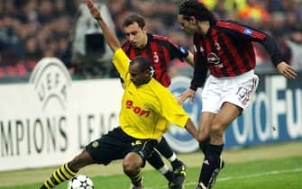 milano 18/3/2003 milan borussia dortmund ewerthon contrastato da nesta e bucchi ansa carlo ferraro