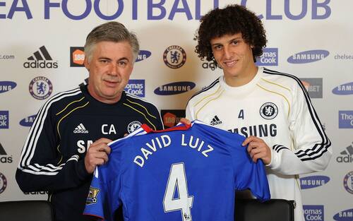 COBHAM, ENGLAND - FEBRUARY 11:  David Luiz of Chelsea is presented his shirt by Chelsea manager Carlo Ancelotti during a press conference at the Cobham training ground on February 11, 2011 in Cobham, England.  (Photo by Darren Walsh/Chelsea FC via Getty Images)