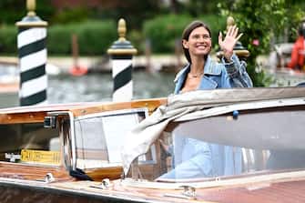 Italian model Bianca Balti waves from a taxi boat as she arrives the Excelsior Hotel pier on August 30, 2023 on the opening day of the 80th Venice Film Festival at Venice Lido. (Photo by GABRIEL BOUYS / AFP) (Photo by GABRIEL BOUYS/AFP via Getty Images)