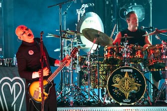 CHARLOTTE, NORTH CAROLINA - AUGUST 22: Singer/guitarist Billy Corgan (L) and drummer Jimmy Chamberlin of Smashing Pumpkins perform at PNC Music Pavilion on August 22, 2023 in Charlotte, North Carolina. (Photo by Jeff Hahne/Getty Images)