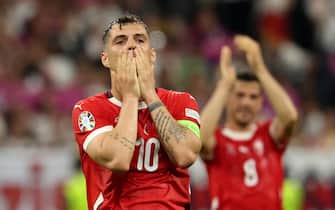 epa11433203 Granit Xhaka of Switzerland reacts after missing an opportunity to score during the UEFA EURO 2024 group A soccer match between Switzerland and Germany, in Frankfurt am Main, Germany, 23 June 2024.  EPA/FRIEDEMANN VOGEL