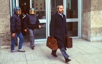 The Italian judge Giovanni Falcone was escorted by police out of the Court of Palermo, Italy, on May 16, 1985. Giovanni Falcone was killed by the Mafia in 1992.  ( Photo by Vittoriano Rastelli )