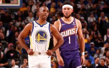 SAN FRANCISCO, CA - OCTOBER 24: Chris Paul #3 of the Golden State Warriors and Devin Booker #1 of the Phoenix Suns talk during the game on October 24, 2023 at Chase Center in San Francisco, California. NOTE TO USER: User expressly acknowledges and agrees that, by downloading and or using this photograph, user is consenting to the terms and conditions of Getty Images License Agreement. Mandatory Copyright Notice: Copyright 2023 NBAE (Photo by Jed Jacobsohn/NBAE via Getty Images)