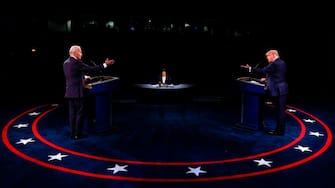 TOPSHOT - US President Donald Trump (R) Democratic Presidential candidate, former US Vice President Joe Biden and moderator, NBC News anchor, Kristen Welker (C) participate in the final presidential debate at Belmont University in Nashville, Tennessee, on October 22, 2020. (Photo by JIM BOURG / POOL / AFP) (Photo by JIM BOURG/POOL/AFP via Getty Images)