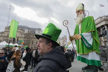 LONDON, UNITED KINGDOM - MARCH 12: People gather at the Trafalgar Square during the Saint Patrick's Day Festival in London, United Kingdom on March 12, 2023. Saint PatrickÃ¢s Day is one of the IrelandÃ¢s national days. Associations, sports clubs and orchestras from various regions of United Kingdom and Ireland, citizens of other countries living in London attended the Saint PatrickÃ¢s Day celebrations with their traditional costumes, make-up and music. (Photo by Rasid Necati Aslim/Anadolu Agency via Getty Images)