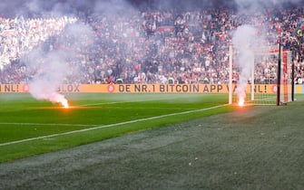 AMSTERDAM, NETHERLANDS - SEPTEMBER 24: Fireworks on the field during the Dutch Eredivisie match between AFC Ajax and Feyenoord at Johan Cruijff Arena on September 24, 2023 in Amsterdam, Netherlands. (Photo by NESimages/Herman Dingler/DeFodi Images via Getty Images)