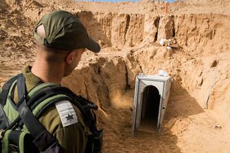 A picture taken on January 18, 2018 from the Israeli side of the border with the Gaza Strip shows a Israeli army officer walking near the entrance of a tunnel, that Israel says was dug by the Islamic Jihad group, leading from the Palestinian enclave into Israel, near southern Israeli kibbutz of Kissufim. Israel uncovered and destroyed the tunnel in late October. (Photo by JACK GUEZ / POOL / AFP) (Photo by JACK GUEZ/POOL/AFP via Getty Images)