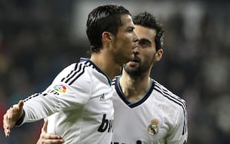 epa03529252 Real Madrid's Portuguese striker Cristiano Ronaldo (L) celebrates scoring against Celta with his teammate Alvaro Arbeloa during their King's Cup round of 16 second leg match played at Santiago Bernabeu stadium in Madrid, Spain, 09 January 2013.  EPA/VICTOR LERENA