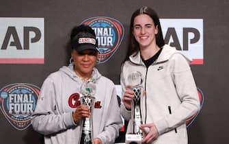 CLEVELAND, OHIO - APRIL 04: AP Coach of the Year Dawn Staley of the South Carolina Gamecocks and AP Player of the Year Caitlin Clark #22 of the Iowa Hawkeyes pose during the award press conference ahead of the 2024 NCAA Women's Basketball Tournament Final Four at Rocket Mortgage Fieldhouse on April 04, 2024 in Cleveland, Ohio. (Photo by Gregory Shamus/Getty Images)