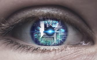 Female eye with overlay of printed circuit board. Concepts of Artificial intelligence development or Microchip implants