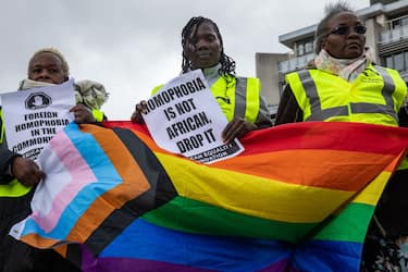 LGBT+ campaigners from African Equality Foundation protest opposite Westminster Abbey where King Charles III and Commonwealth leaders were attending a Commonwealth Day service on 13 March 2023 in London, United Kingdom. The protest, which was led by Ugandan LGBT+ people, was intended to highlight the fact that same-sex relations are still criminalised in 32 out of 56 Commonwealth member states (seven with life imprisonment) and to draw attention to Uganda's repressive Anti-Homosexuality Bill. (photo by Mark Kerrison/In Pictures via Getty Images)